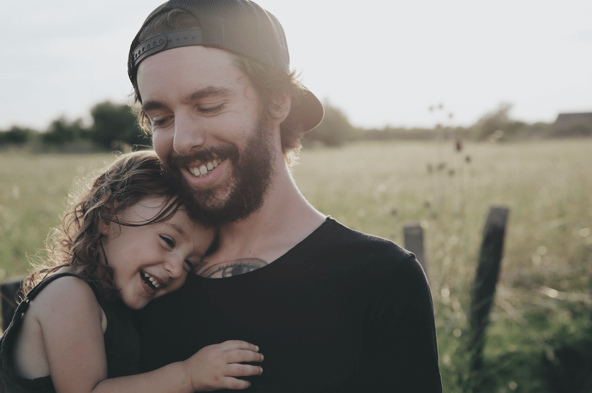 man holding daughter